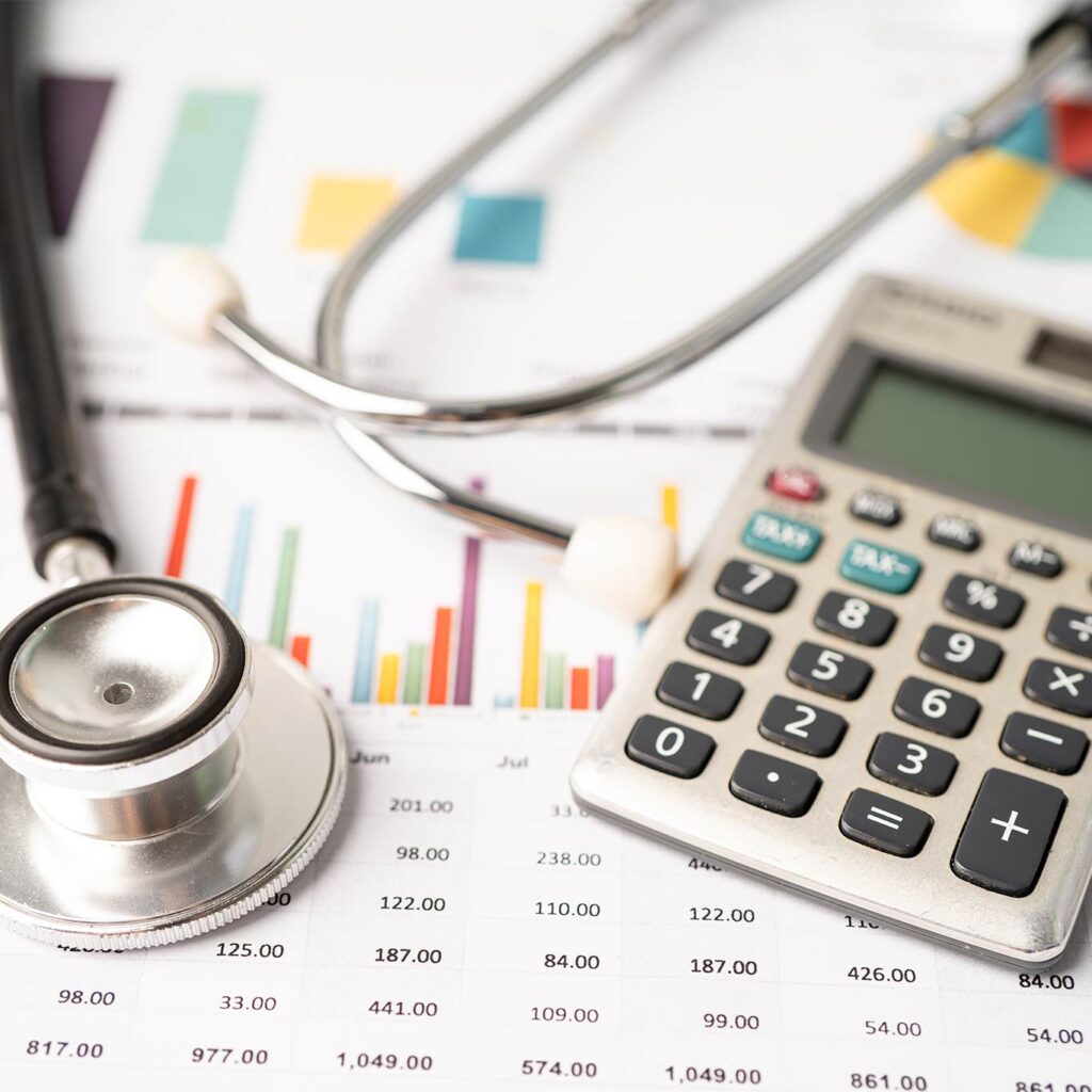 Stethoscope and calculator on charts, illustrating why the PREVENT risk calculator is not neutral in the new cholesterol guidelines