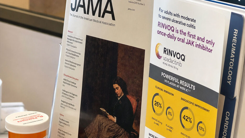 Medical journals beside a prescription bottle and a drug ad, illustrating how the medical-industrial complex is normalized